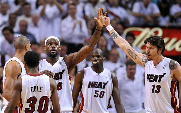 LeBron James greets shooting guard Mike Miller